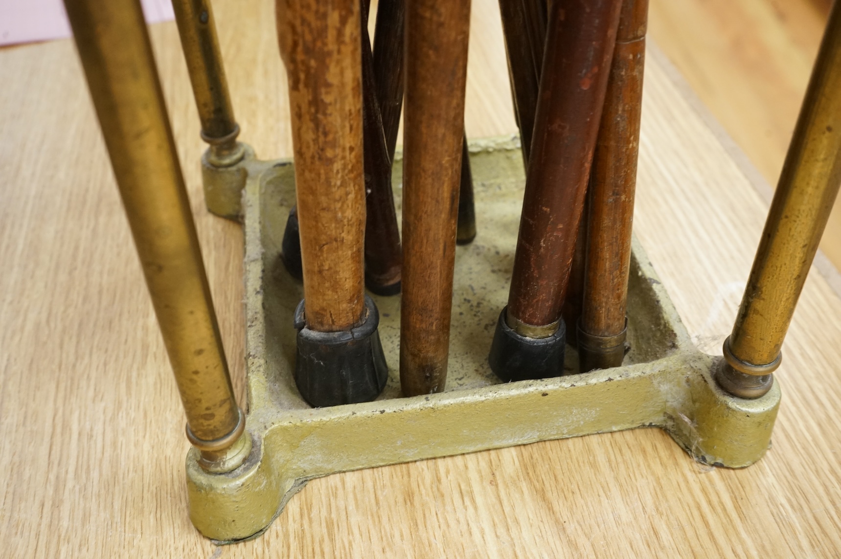 A collection of various walking sticks, some silver mounted and a brass stick stand, 67cm high